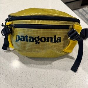Patagonia Fanny pack/cross body bag. Can fit a lot of stuff in this! Brand new.